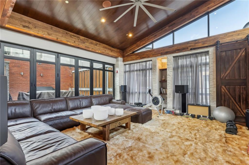 215 25th Street, Unit 7 Pittsburgh, PA 15222 - Photo 7 of 49 a living room with furniture and a large window