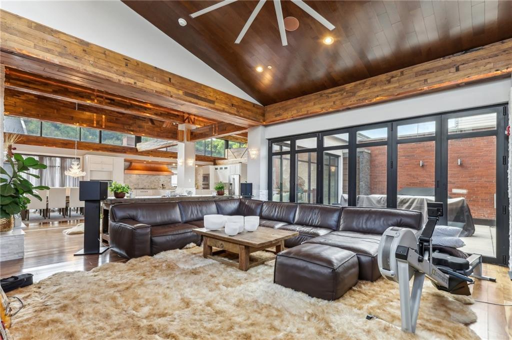 215 25th Street, Unit 7 Pittsburgh, PA 15222 - Photo 8 of 49 a living room with furniture and a flat screen tv