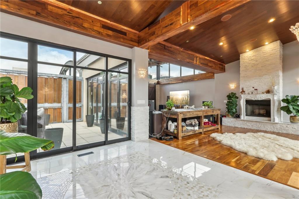 215 25th Street, Unit 7 Pittsburgh, PA 15222 - Photo 9 of 49 a bedroom with furniture and a large window