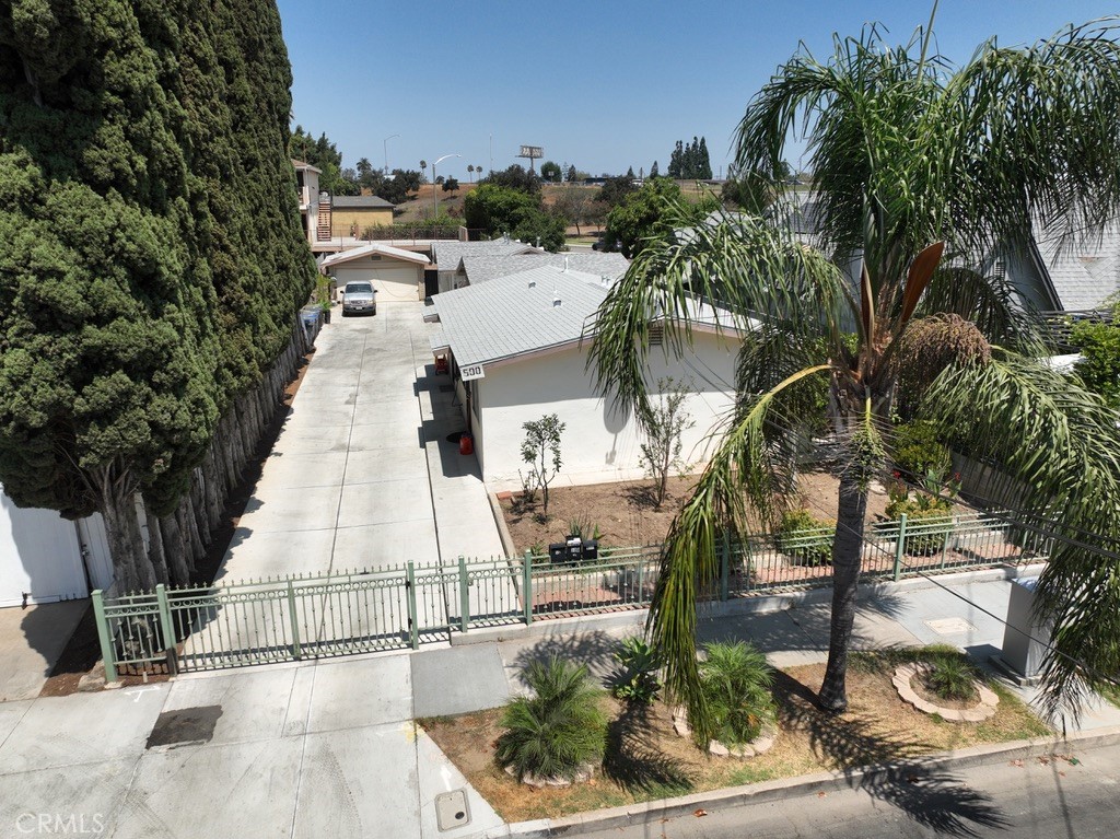 500 East 15th Street Santa Ana, CA 92701 - Photo 2 of 8 a view of a yard with plants and a bench