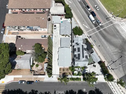 an aerial view of a residential apartment building with a yard