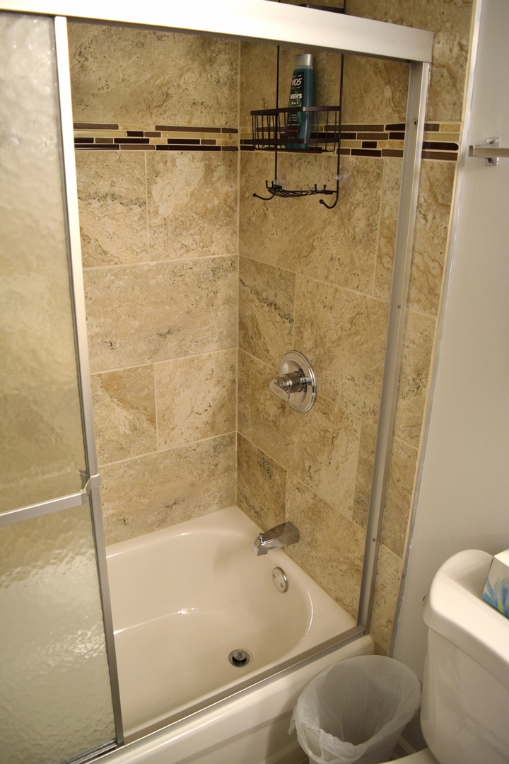 1905 West Golf Road, Unit 1A Mount Prospect, IL 60056 - Photo 15 of 24 a bathroom with a shower and a toilet