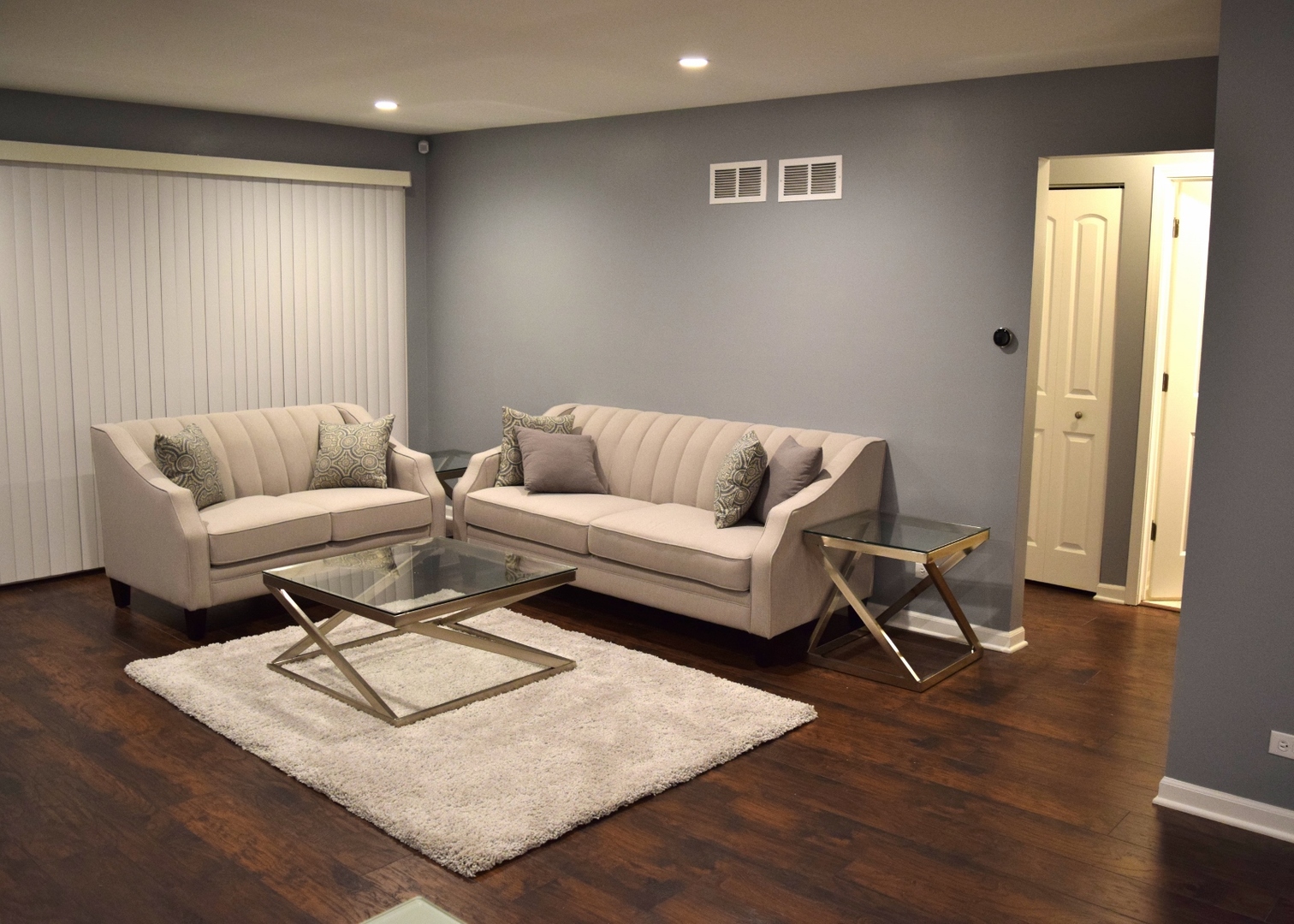 1905 West Golf Road, Unit 1A Mount Prospect, IL 60056 - Photo 2 of 24 a living room with furniture and a wooden floor