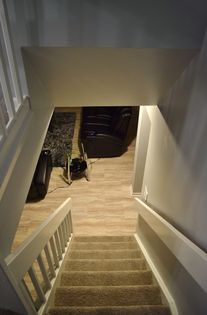 1905 West Golf Road, Unit 1A Mount Prospect, IL 60056 - Photo 21 of 24 a view of staircase with wooden floor