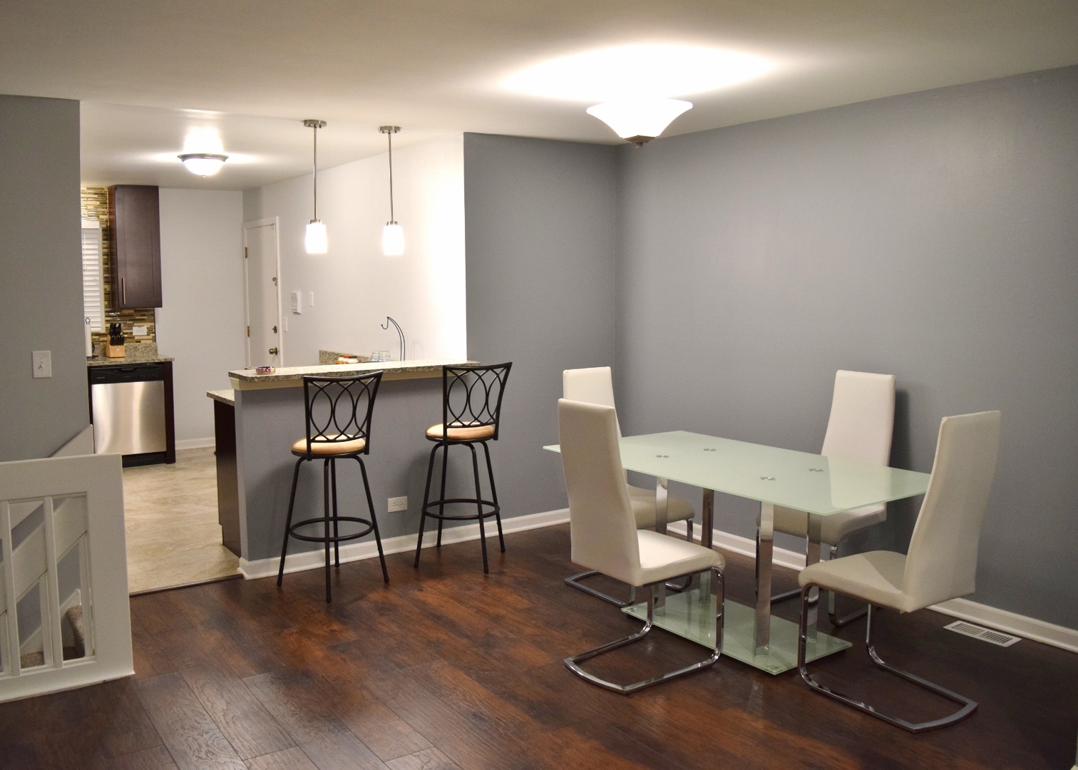 1905 West Golf Road, Unit 1A Mount Prospect, IL 60056 - Photo 5 of 24 a view of a workspace with furniture and wooden floor
