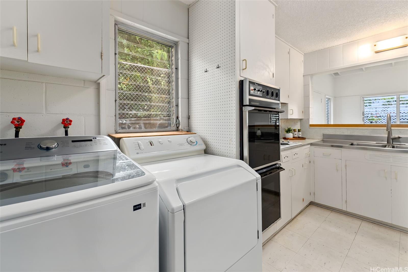 6014 Aimoku Street Honolulu, HI 96821 - Photo 11 of 25 Full washer and dryer inside the kitchen area