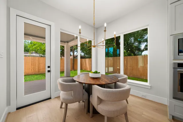 a kitchen with stainless steel appliances granite countertop a sink a stove and refrigerator