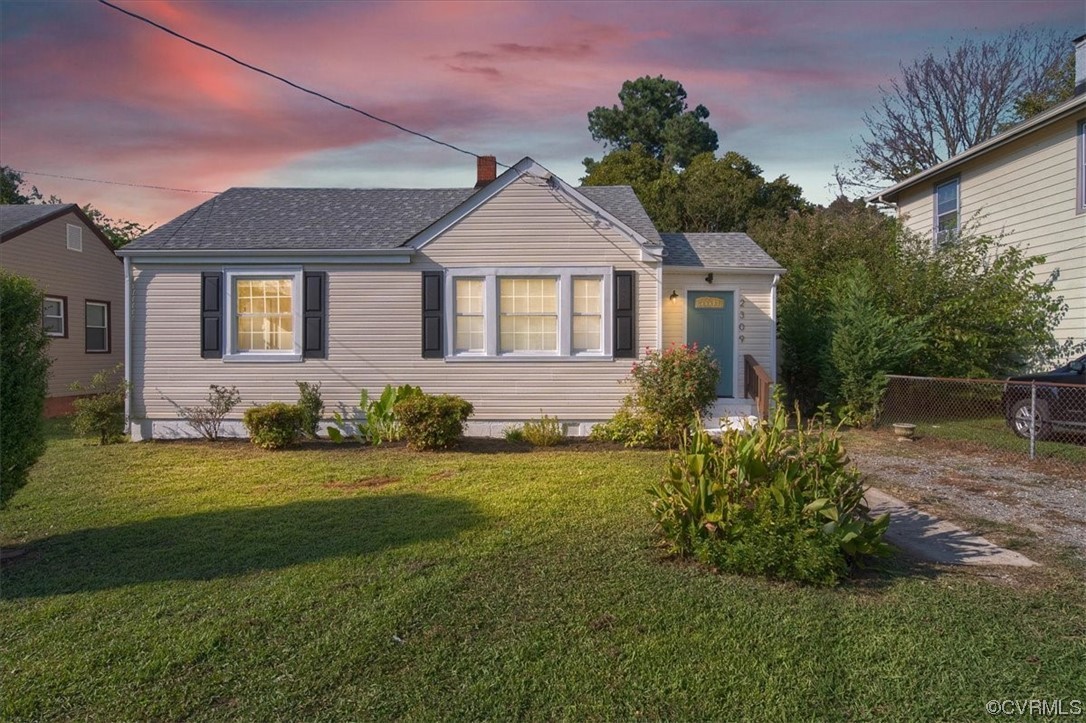 2309 Wright Avenue Richmond, VA 23224 - Photo 1 of 39 a front view of a house with a garden