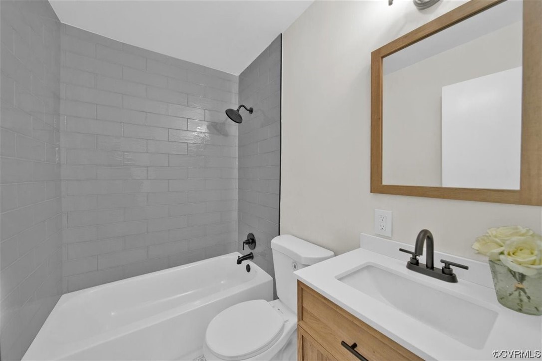2309 Wright Avenue Richmond, VA 23224 - Photo 16 of 39 a bathroom with a granite countertop sink toilet and shower