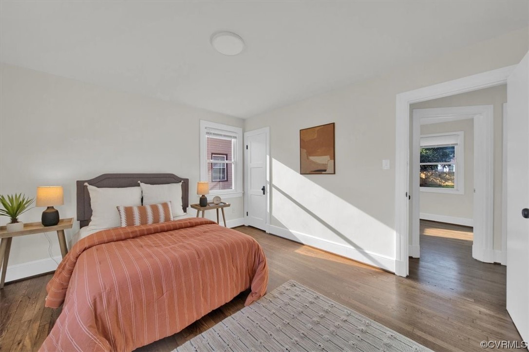 2309 Wright Avenue Richmond, VA 23224 - Photo 20 of 39 a spacious bedroom with a bed and a flat screen tv