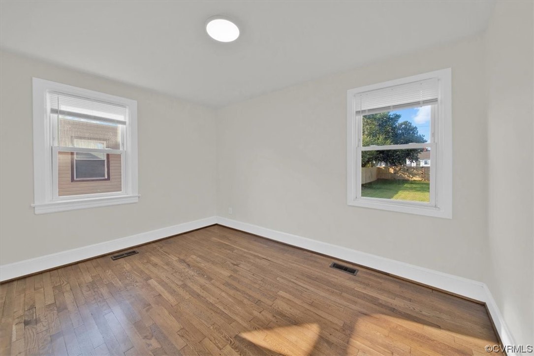 2309 Wright Avenue Richmond, VA 23224 - Photo 21 of 39 a view of empty room with window and wooden floor