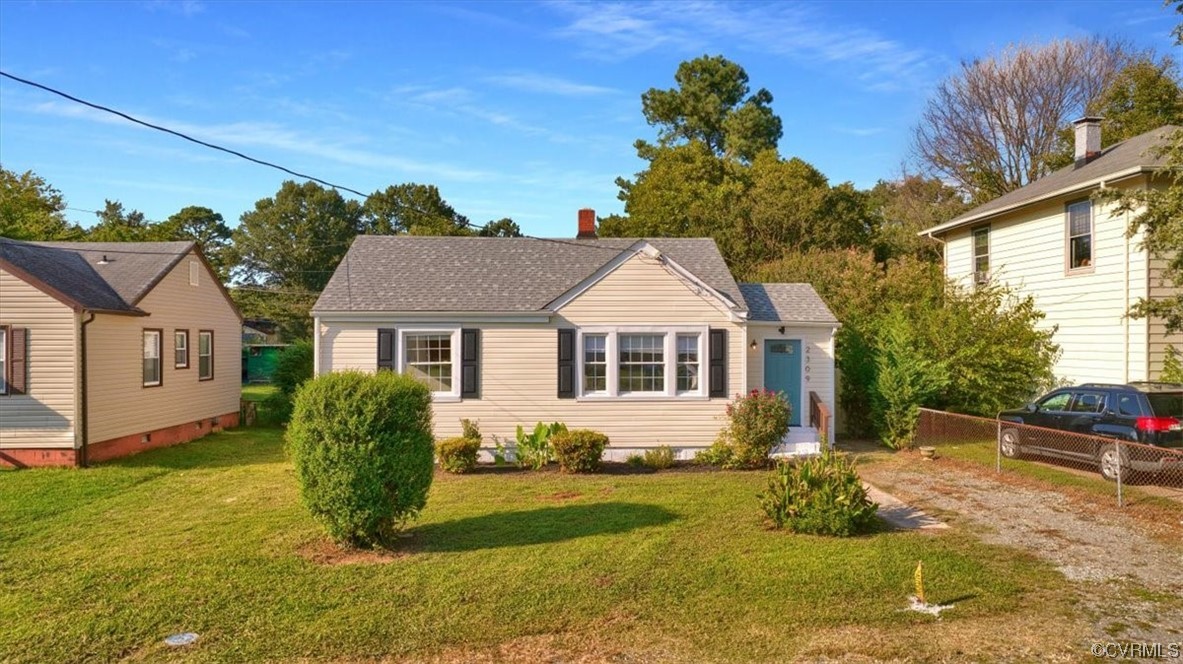 2309 Wright Avenue Richmond, VA 23224 - Photo 34 of 39 a front view of a house with a yard