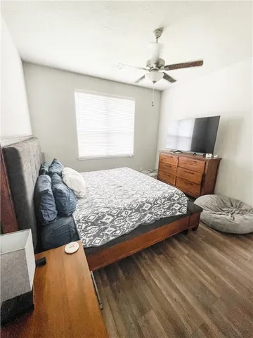 a bedroom with bed and window