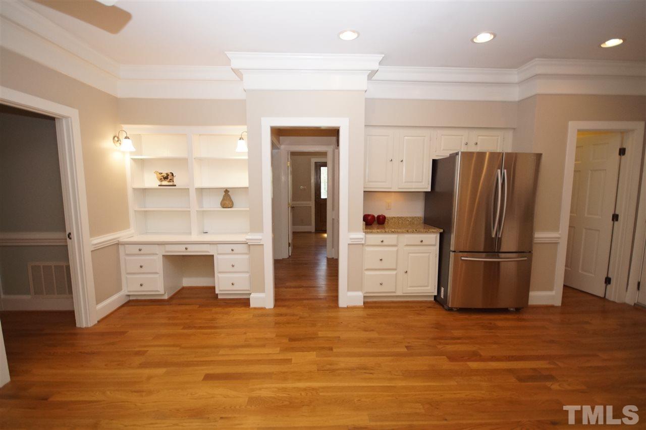 5012 Trail Ridge Drive Raleigh, NC 27613 - Photo 8 of 25 a kitchen with stainless steel appliances a refrigerator and a stove top oven