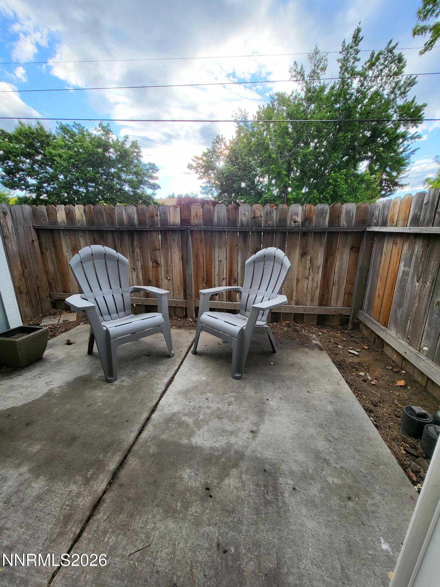 4606 Neil Road, Unit 197 Reno, NV 89502 - Photo 13 of 26 a view of a two chairs in the back yard