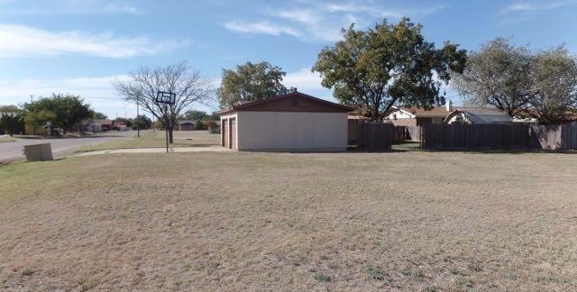 1506 Ave O Ralls, TX 79357 - Photo 2 of 10 a front view of a house with a yard and trees