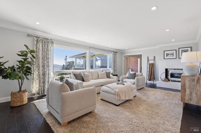 a living room with furniture and a large mirror