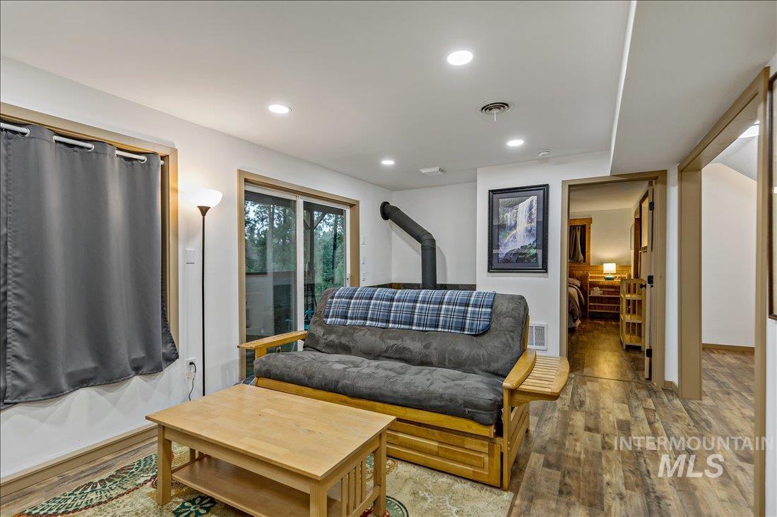 79 Sunset Loop Cascade, ID 83611 - Photo 28 of 44 Living space featuring wood-finish flooring, recessed lighting, and a sliding glass door