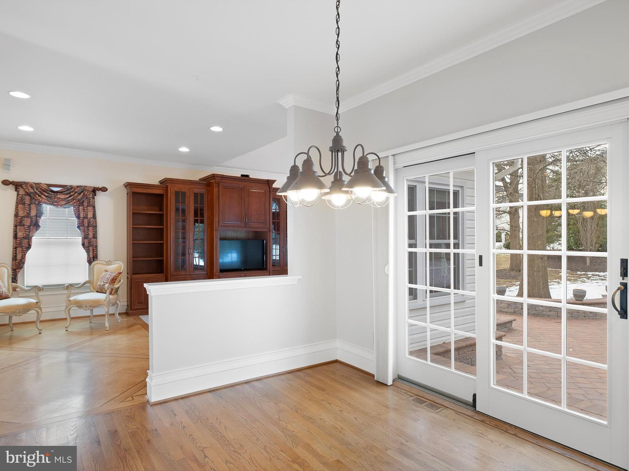 604 Oriole Place Hockessin, DE 19707 - Photo 11 of 40 a view of a room with wooden floor and windows