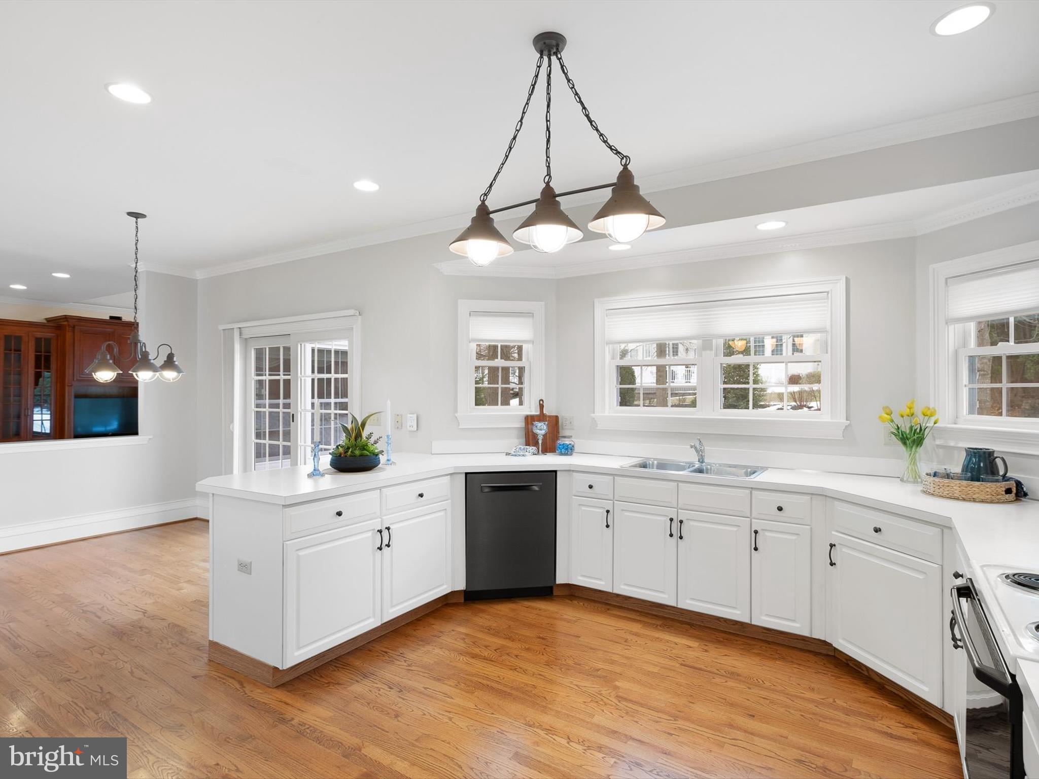 604 Oriole Place Hockessin, DE 19707 - Photo 12 of 40 a large kitchen with a sink stainless steel appliances and cabinets