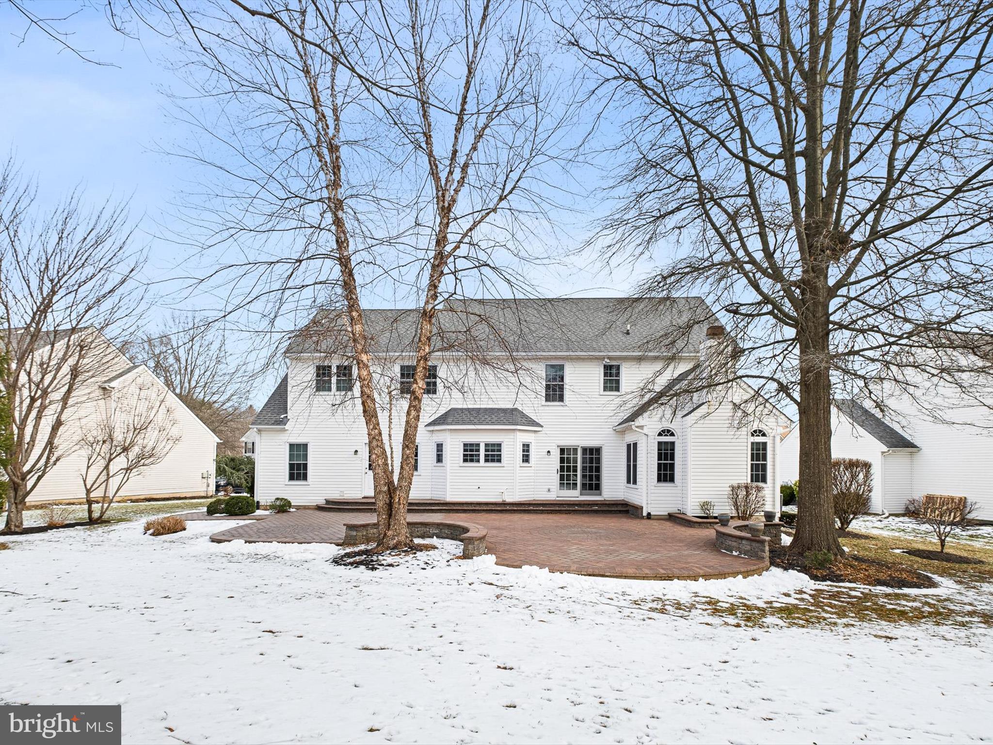 604 Oriole Place Hockessin, DE 19707 - Photo 22 of 40 a view of white house with a snow on the road