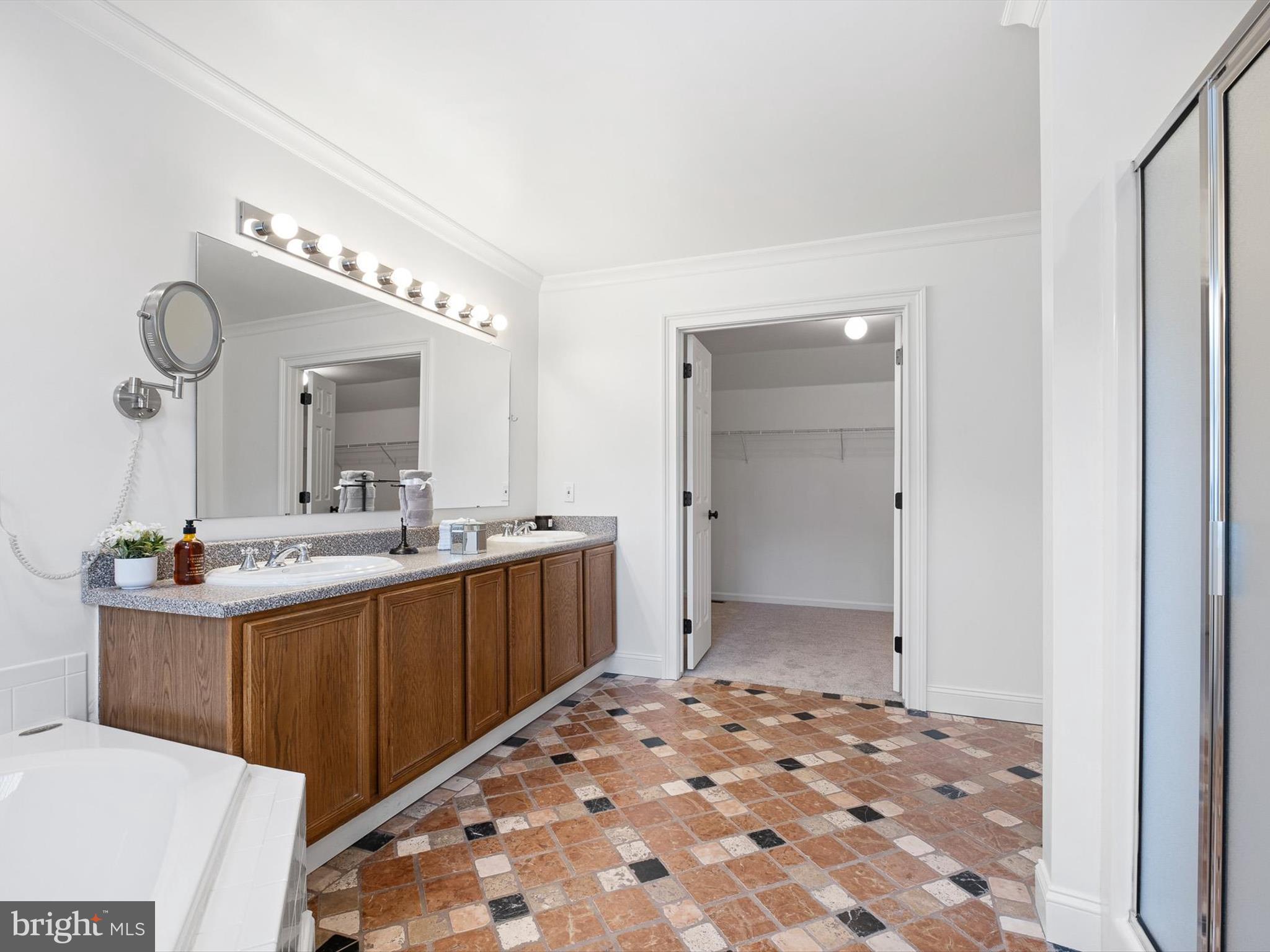 604 Oriole Place Hockessin, DE 19707 - Photo 27 of 40 a bathroom with a sink and a mirror