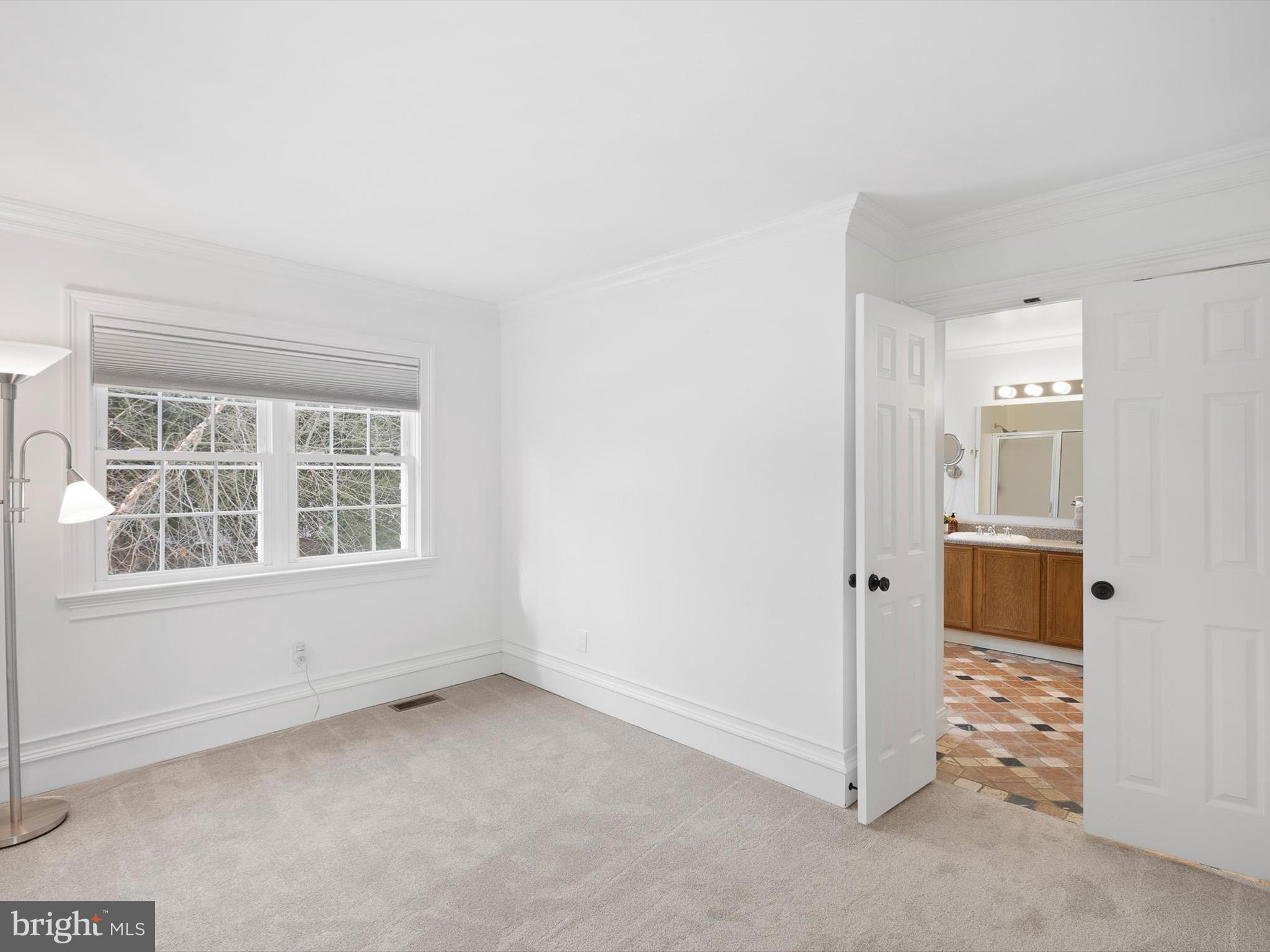 604 Oriole Place Hockessin, DE 19707 - Photo 33 of 40 an empty room with windows