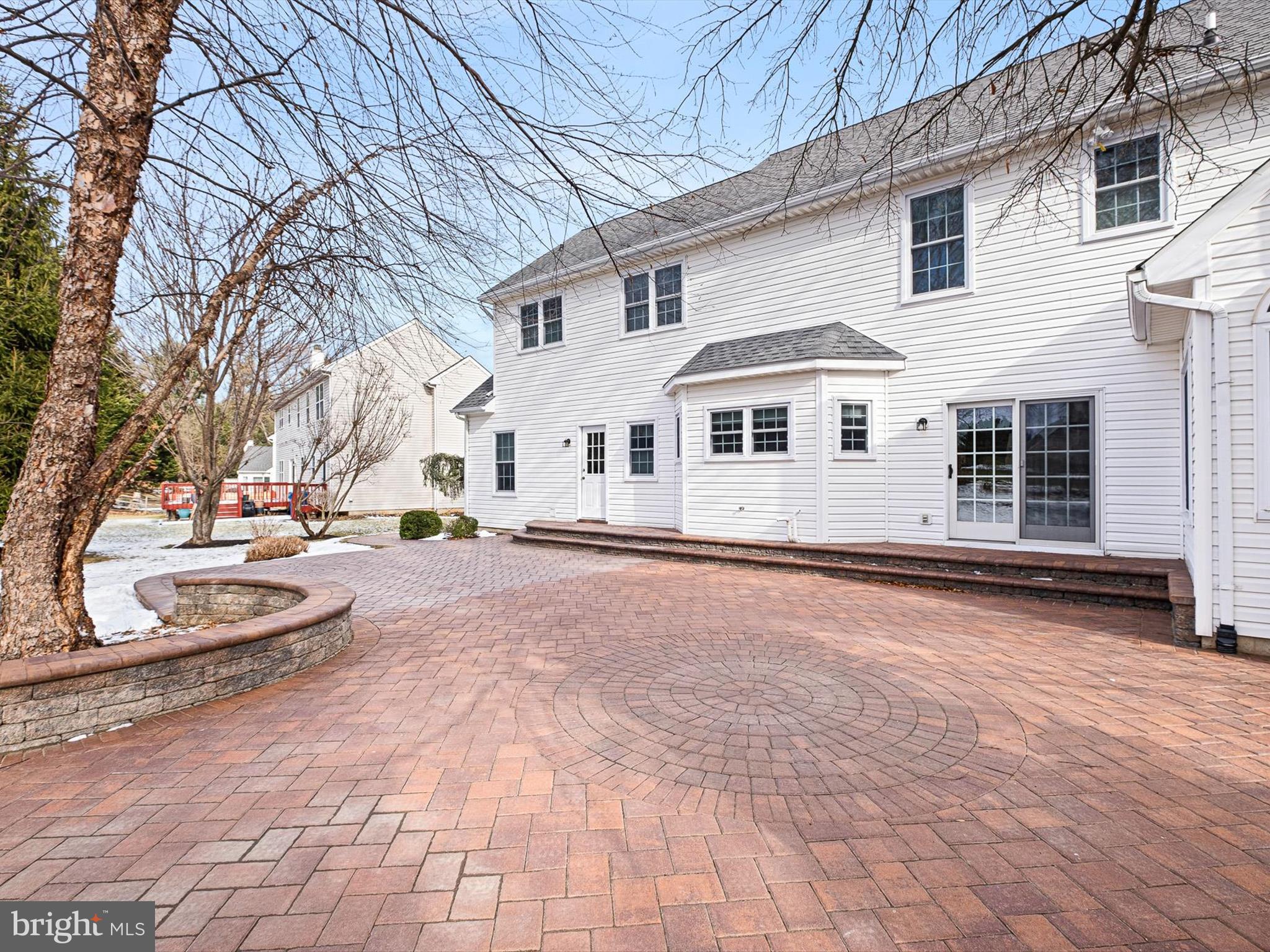 604 Oriole Place Hockessin, DE 19707 - Photo 39 of 40 a view of a white house with a yard covered in snow