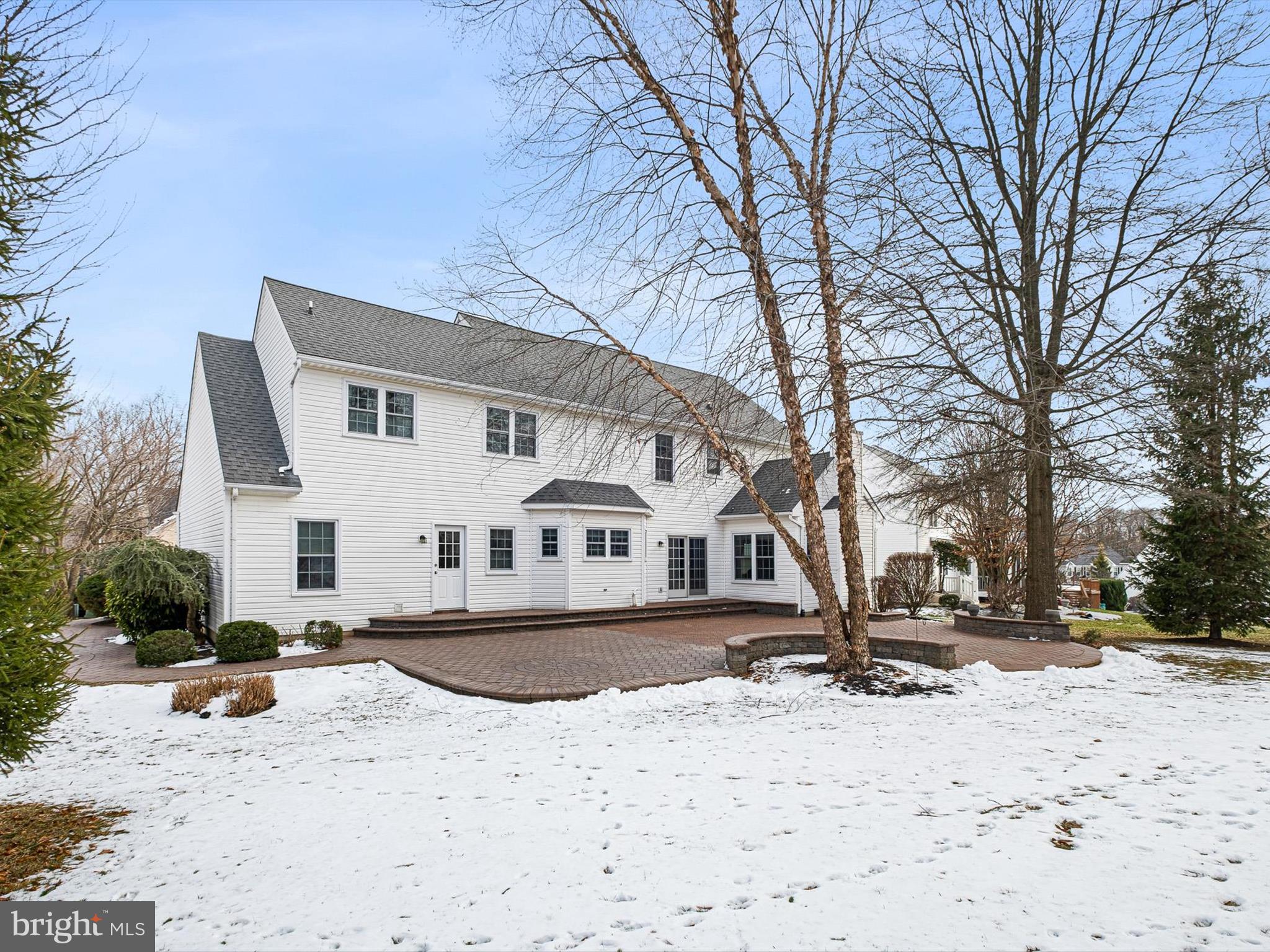 604 Oriole Place Hockessin, DE 19707 - Photo 40 of 40 a front view of a house with a yard covered in snow