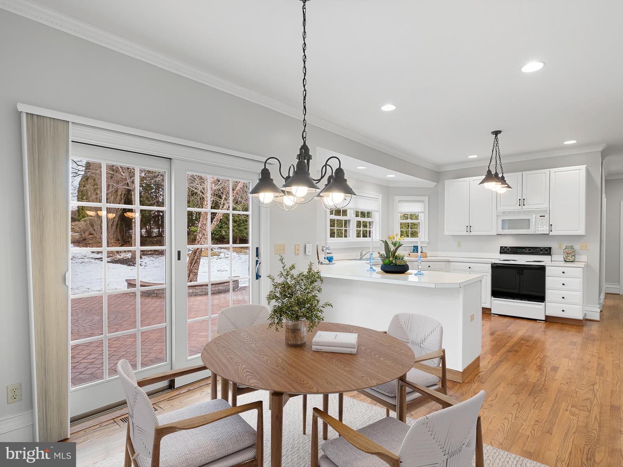 604 Oriole Place Hockessin, DE 19707 - Photo 10 of 40 a view of a dining room with furniture and wooden floor