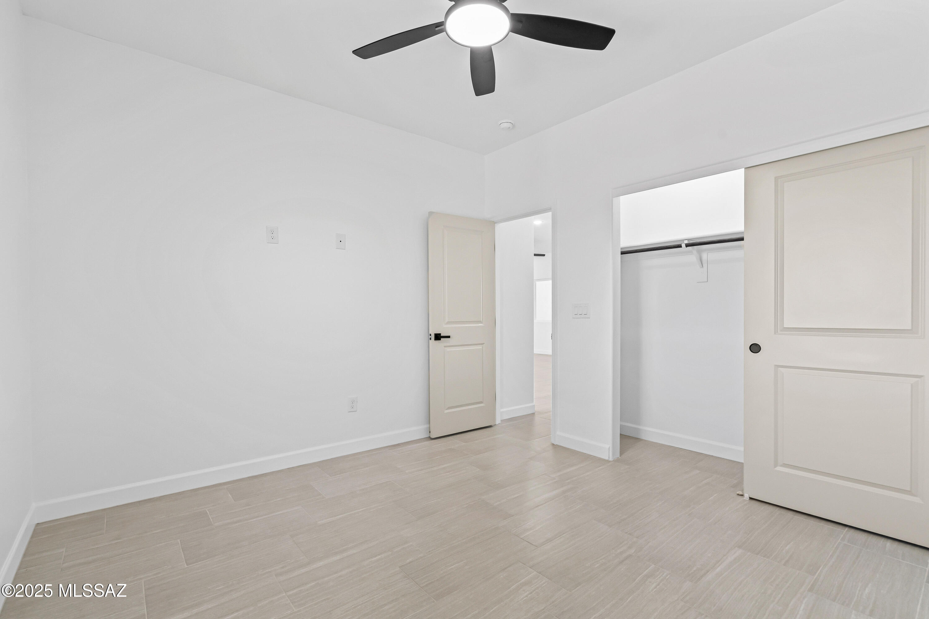 1674 Calle Cabo Rio Rico, AZ 85648 - Photo 27 of 33 an empty room with chandelier fan