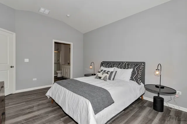 a bedroom with a bed and a chair