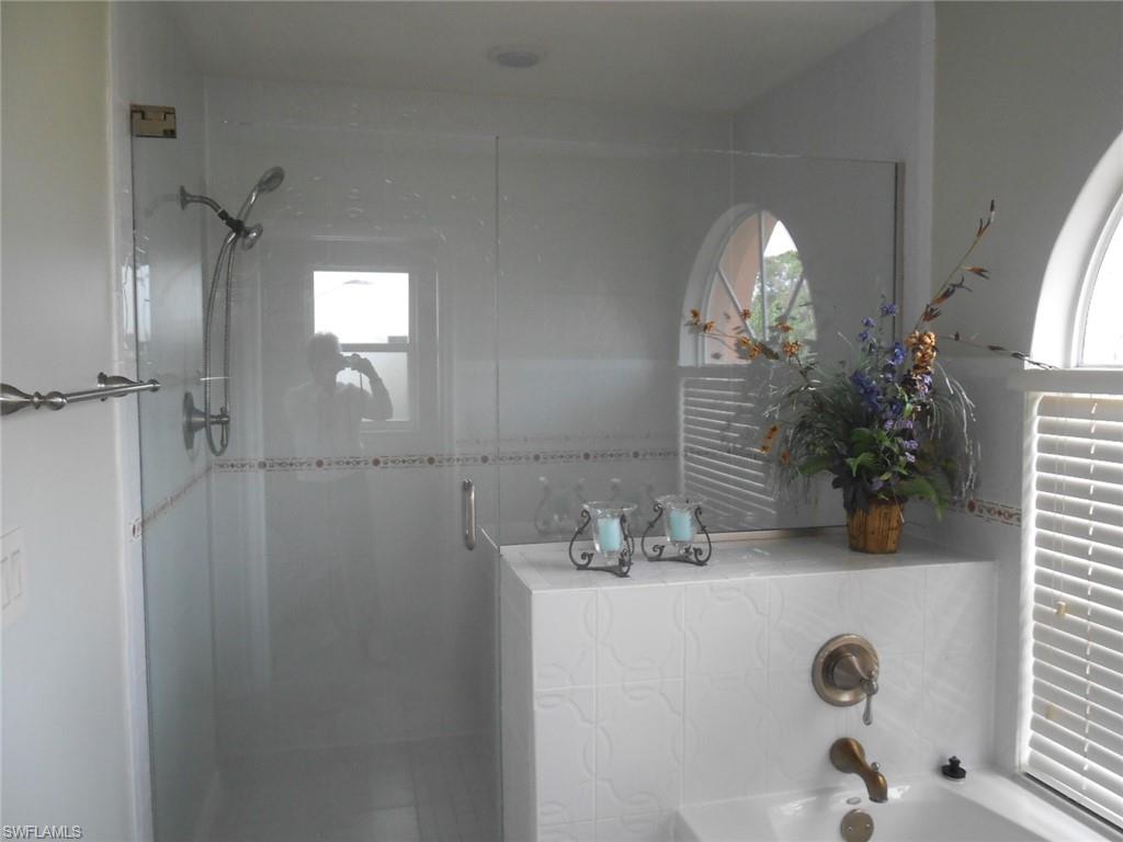 18331 Useppa Road Fort Myers, FL 33967 - Photo 9 of 15 a bathroom with a sink and a mirror