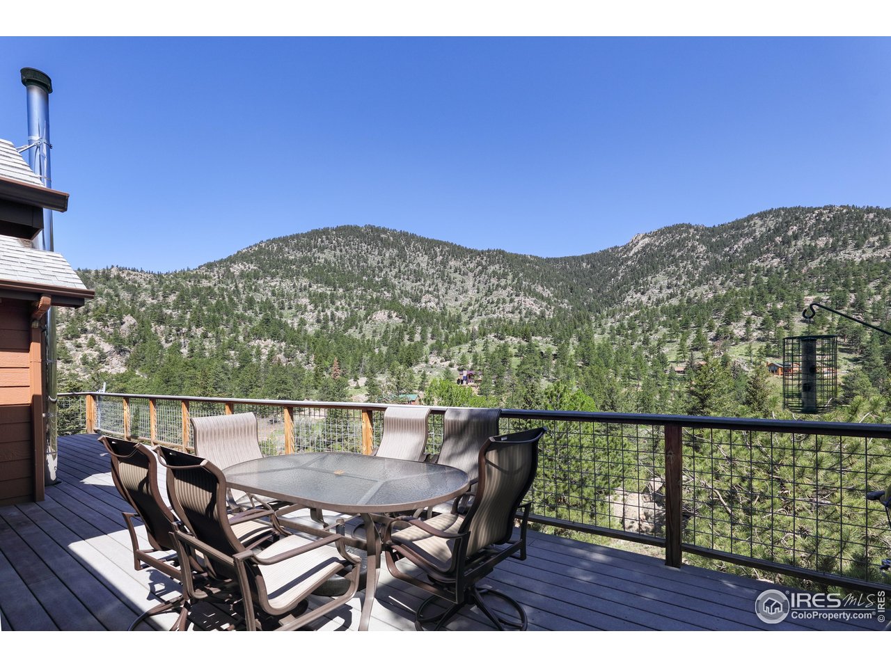 187 Wichita Road Lyons, CO 80540 - Photo 14 of 47 a view of a chairs and table on the terrace