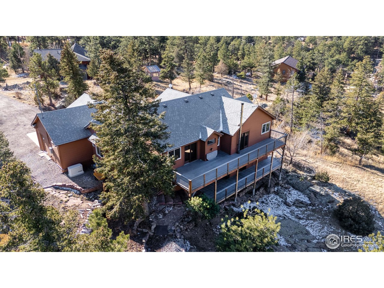 187 Wichita Road Lyons, CO 80540 - Photo 38 of 47 a view of a house with a yard