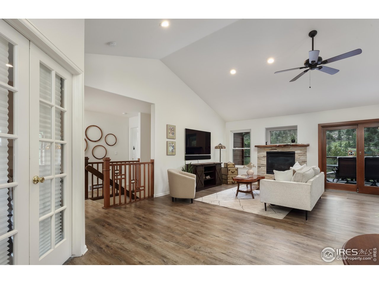 187 Wichita Road Lyons, CO 80540 - Photo 4 of 47 a living room with furniture and a flat screen tv
