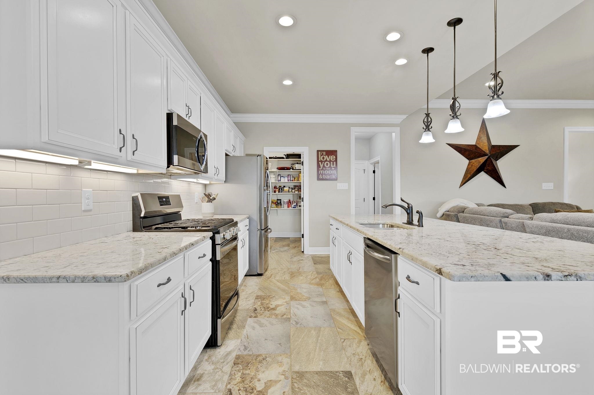 11247 Thistledown Loop Spanish Fort, AL 36527 - Photo 15 of 72 Kitchen with crown molding, stainless steel appliances, backsplash, white cabinets, and a sink