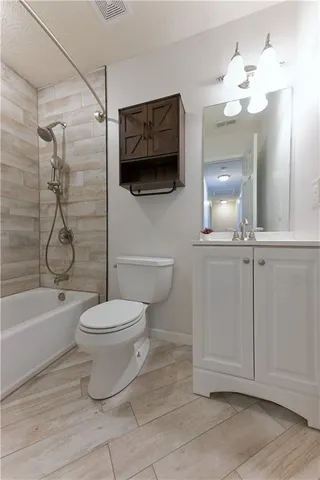 a bathroom with a toilet a sink and bathtub