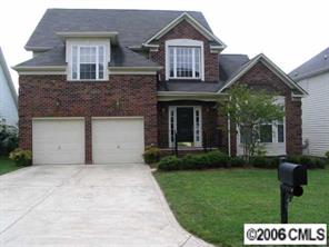6506 Elfreda Road Charlotte, NC 28270 - Photo 1 of 8 a front view of a house with a yard