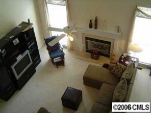 6506 Elfreda Road Charlotte, NC 28270 - Photo 7 of 8 a living room with furniture and a fireplace