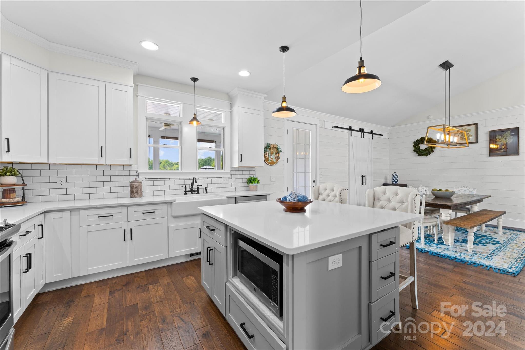 7755 Stokes Ferry Road Salisbury, NC 28146 - Photo 13 of 47 a kitchen that has a sink a stove and a table