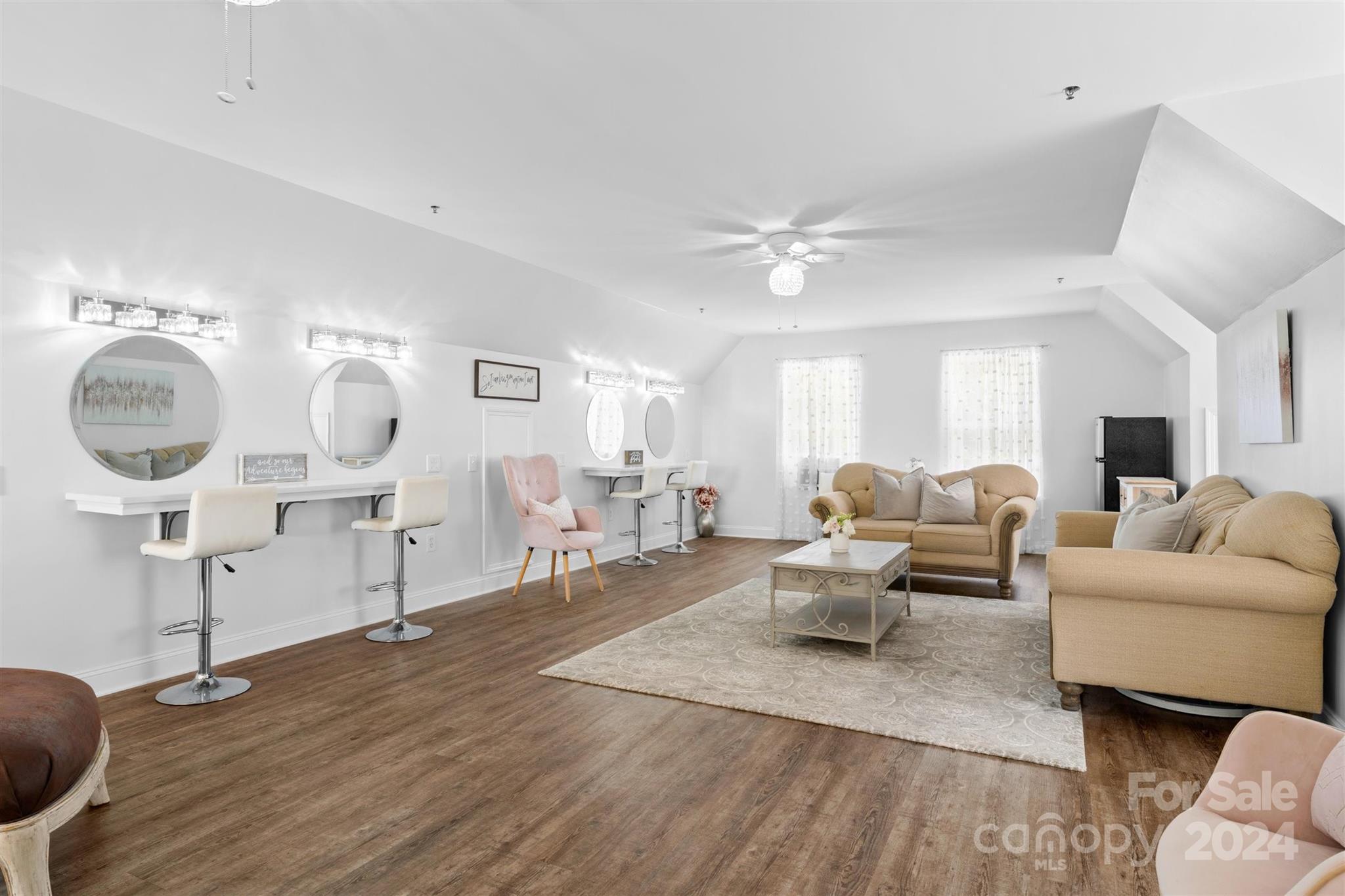 7755 Stokes Ferry Road Salisbury, NC 28146 - Photo 21 of 47 a living room with furniture a mirror and wooden floor