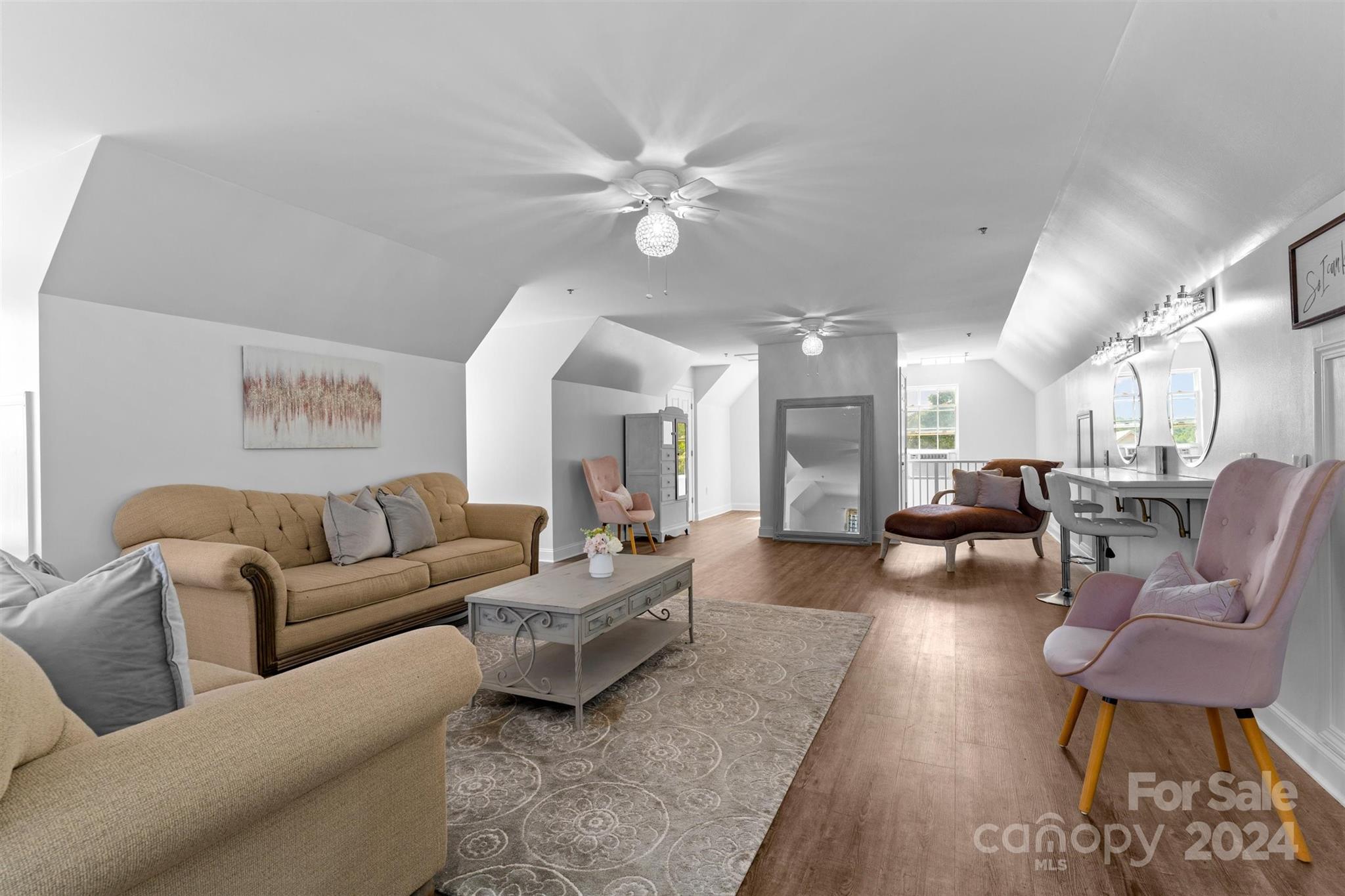 7755 Stokes Ferry Road Salisbury, NC 28146 - Photo 22 of 47 a living room with furniture and a chandelier