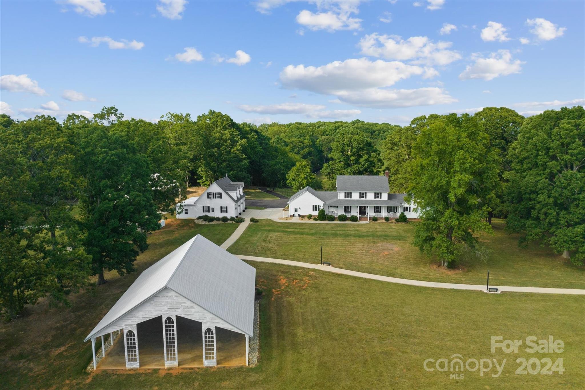 7755 Stokes Ferry Road Salisbury, NC 28146 - Photo 23 of 47 a aerial view of a house with swimming pool and green space
