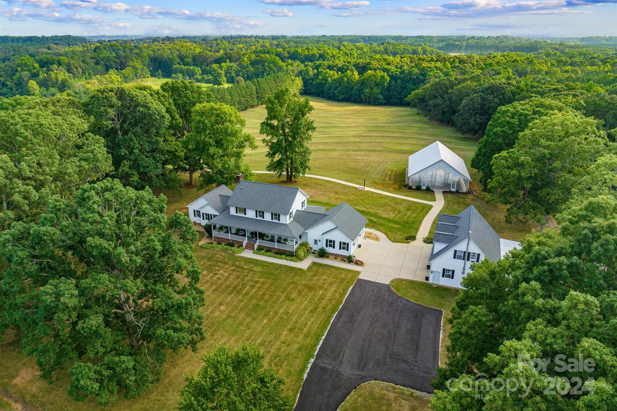 7755 Stokes Ferry Road Salisbury, NC 28146 - Photo 26 of 47 an aerial view of a house with a garden