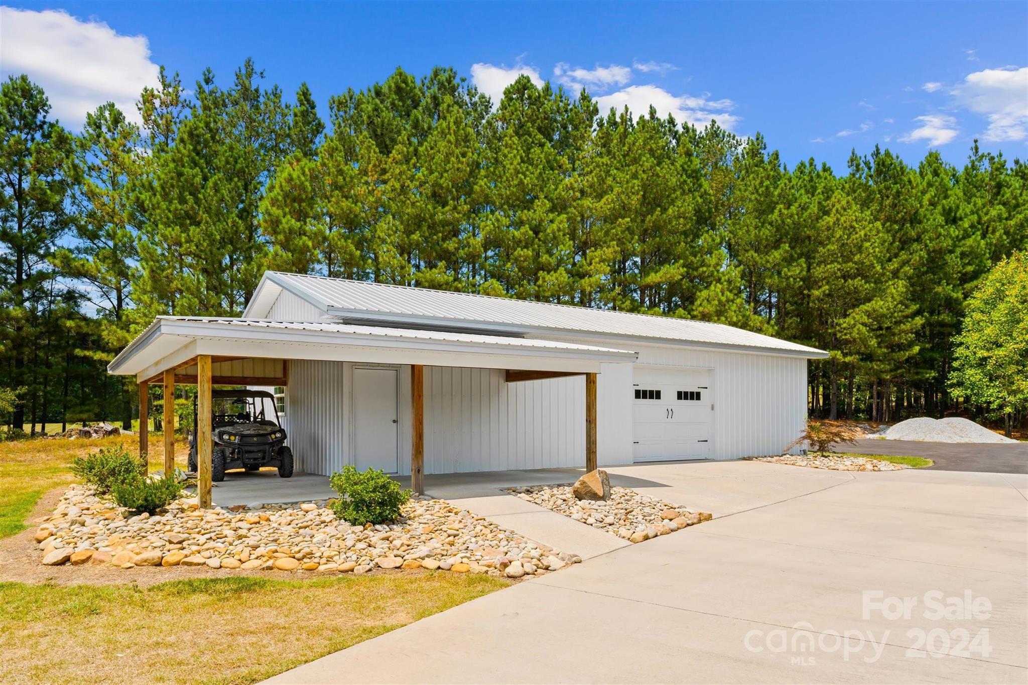 7755 Stokes Ferry Road Salisbury, NC 28146 - Photo 40 of 47 a front view of a house with a yard and garage