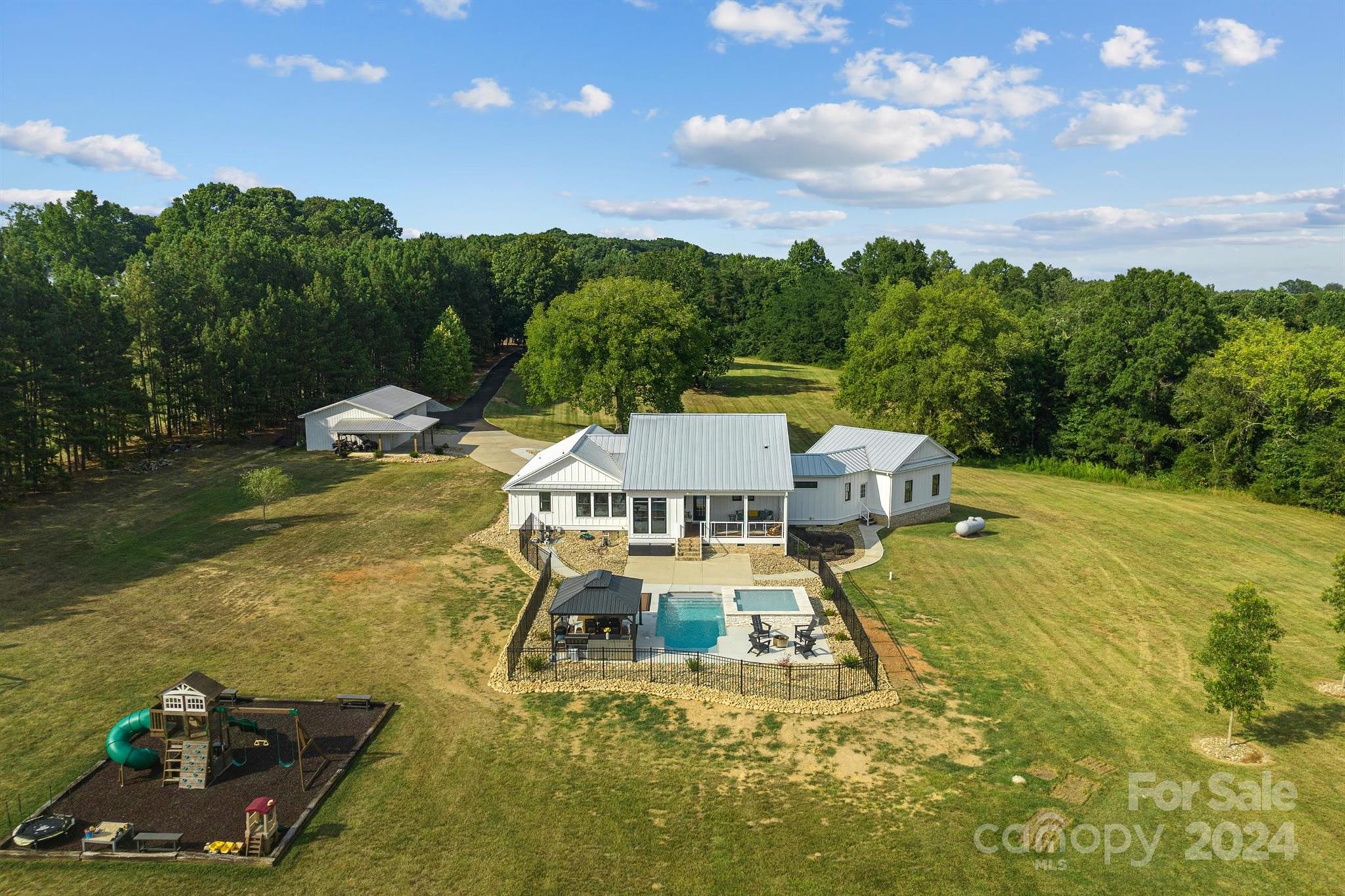 7755 Stokes Ferry Road Salisbury, NC 28146 - Photo 41 of 47 a view of a swimming pool with lounge chair