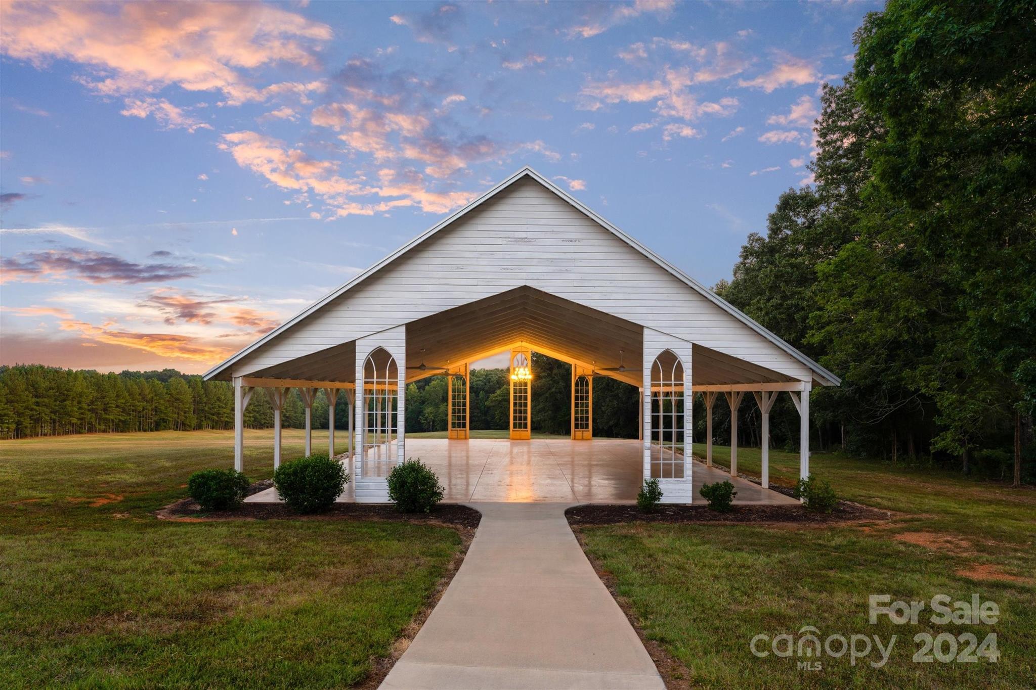 7755 Stokes Ferry Road Salisbury, NC 28146 - Photo 6 of 47 a view of a house with backyard and garden