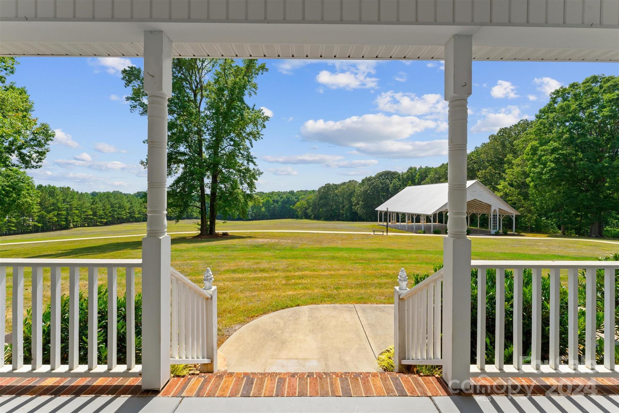 7755 Stokes Ferry Road Salisbury, NC 28146 - Photo 9 of 47 a view of a swimming pool with a balcony