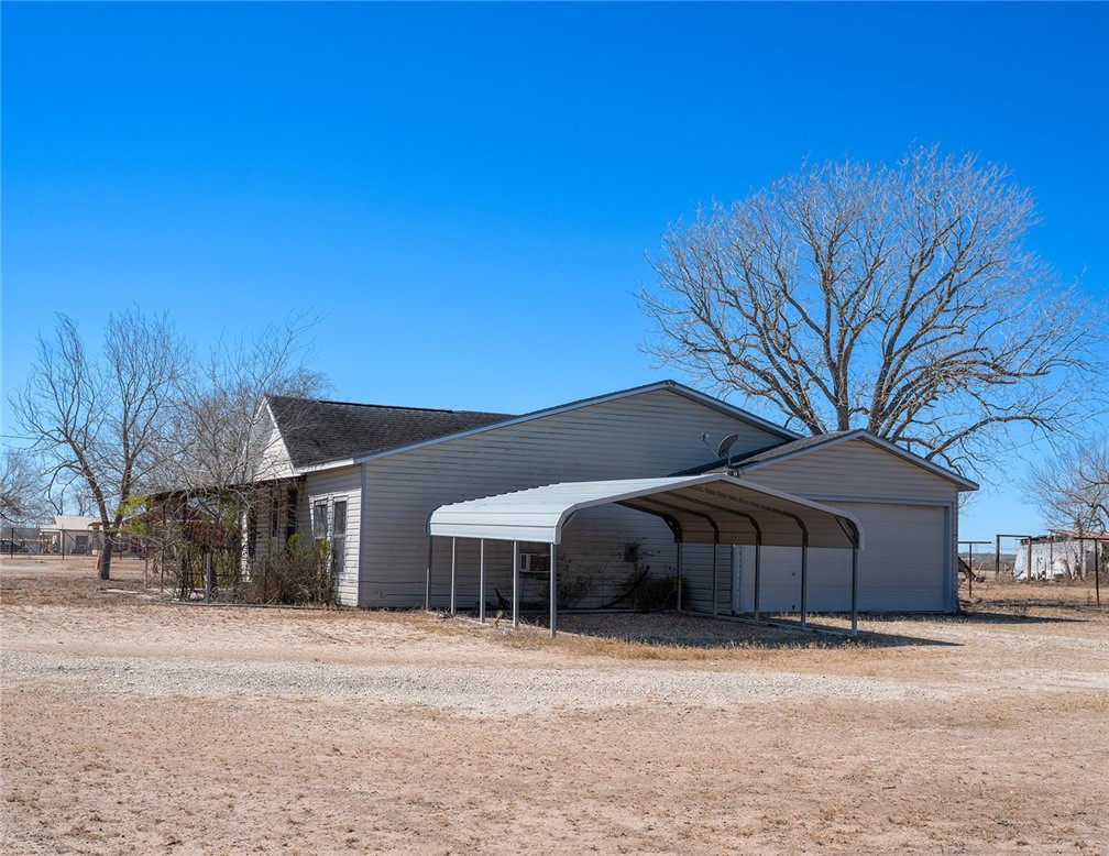 1580 Middle George West, TX 78022 - Photo 13 of 15 a front view of a house with a yard and garage